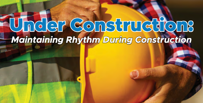 A person holding a yellow hard hat, the title reads