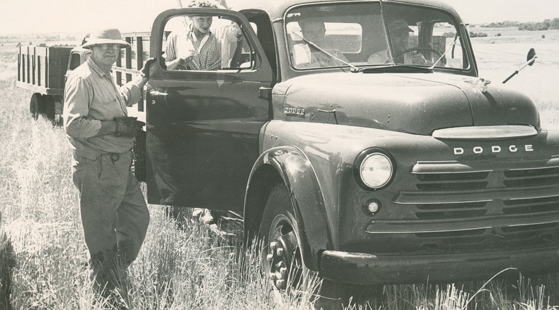 A black and white photo of a dodge truck