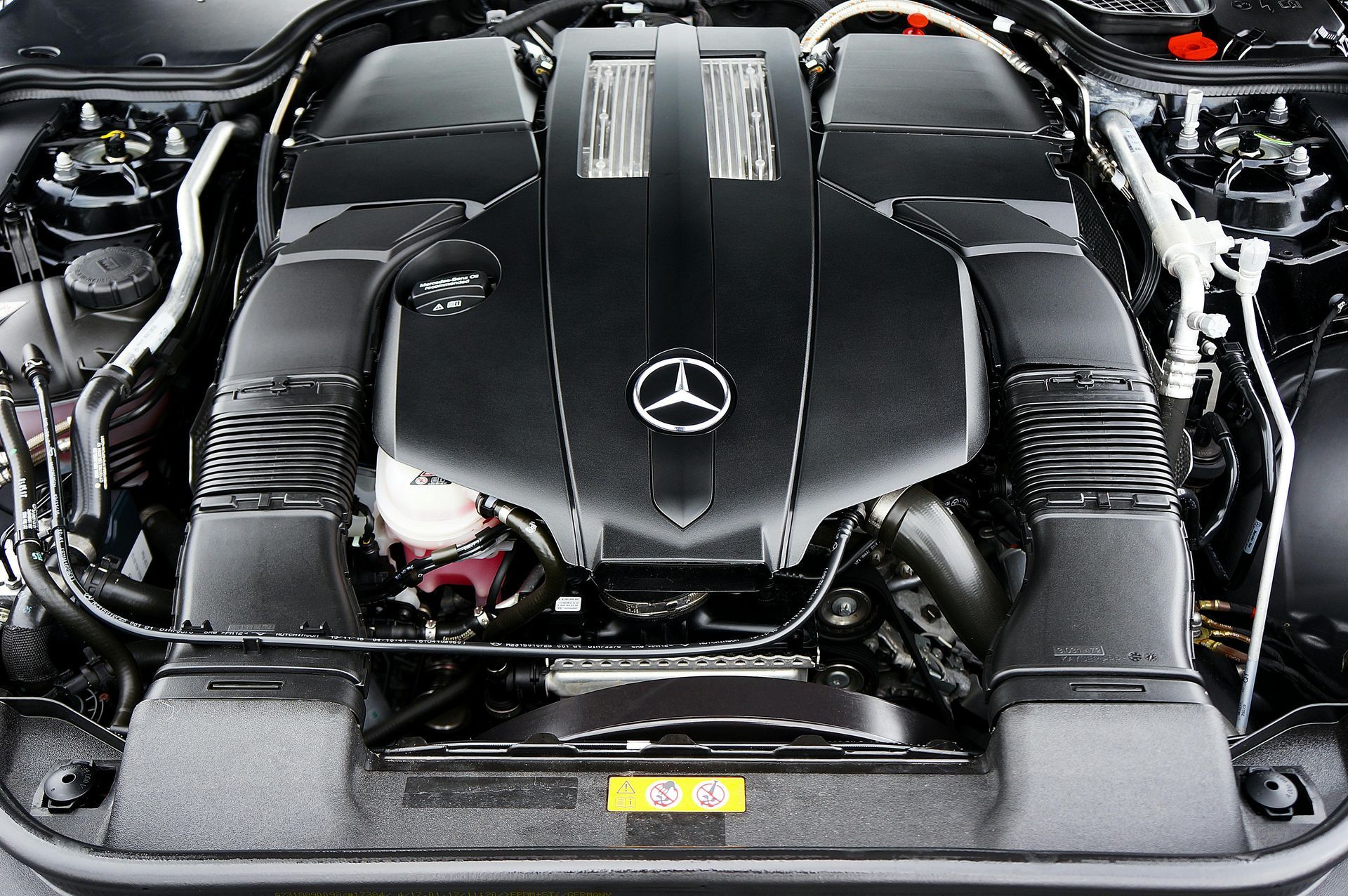 A close up of the engine of a mercedes benz