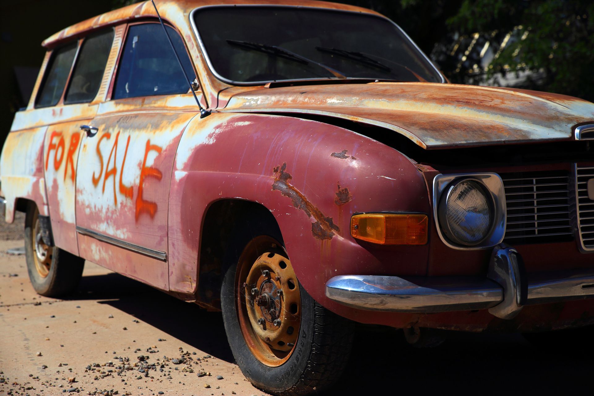 An old, vintage car being offered for sale An old, vintage car being offered for sale