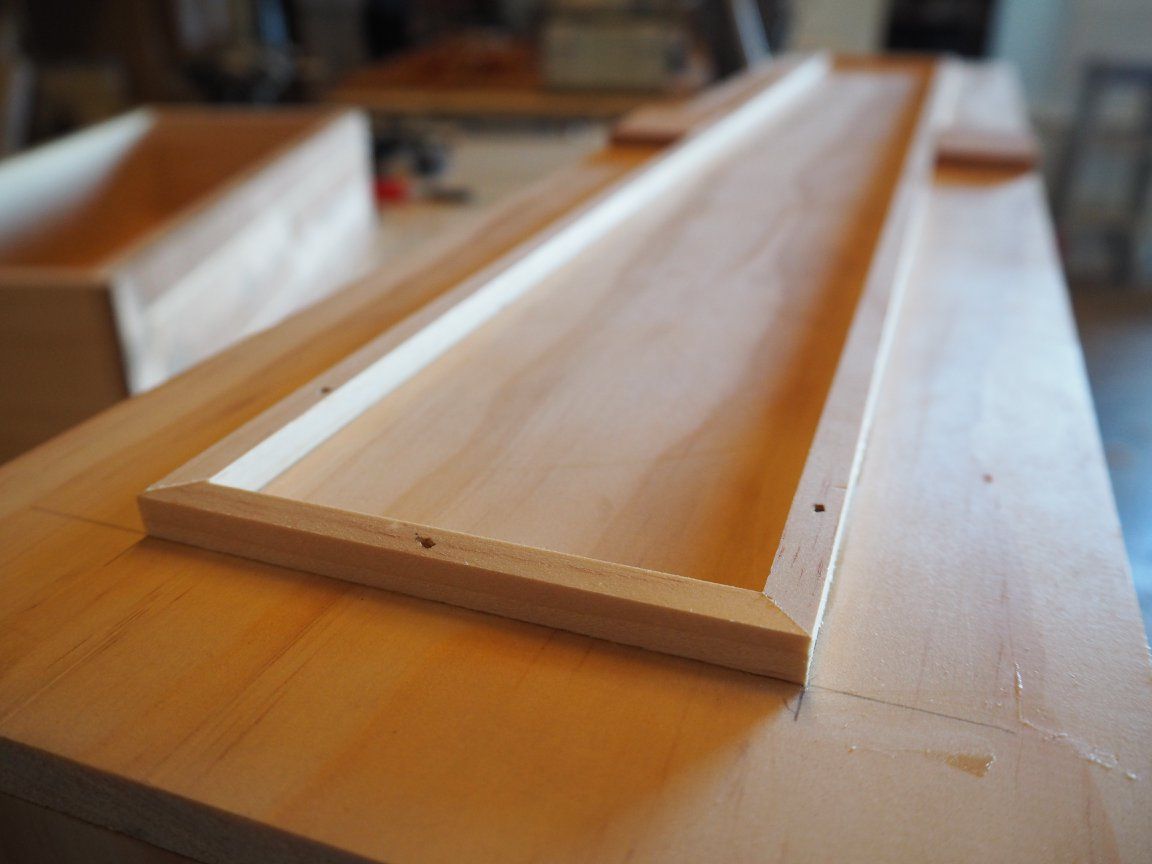 A Piece of Wood Is Sitting on Top of A Wooden Table — Simonetto'S Cabinets & Joinery in Caloundra, QLD