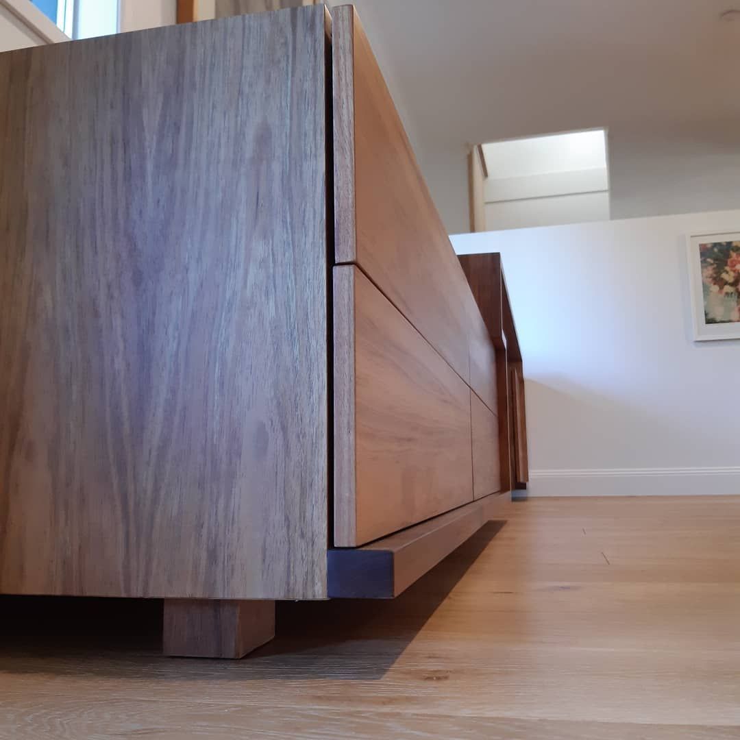 A Wooden Dresser in A Room with A Picture on The Wall — Simonetto'S Cabinets & Joinery in Nambour, QLD