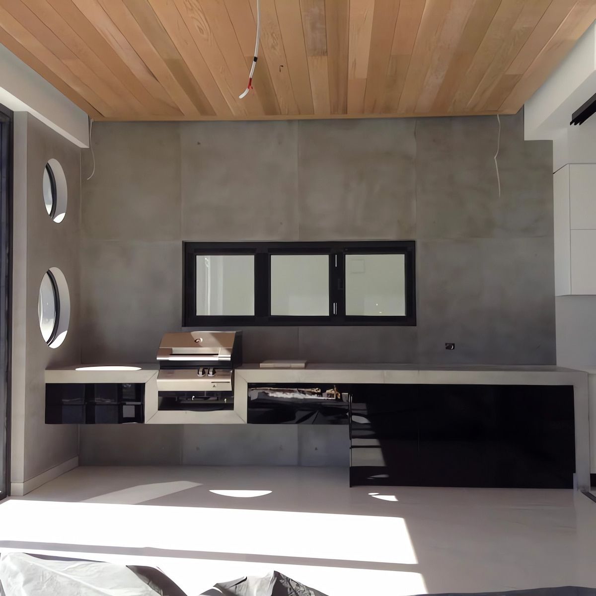 A Living Room with A Wooden Ceiling and Black Cabinets — Simonetto'S Cabinets & Joinery in Nambour, QLD