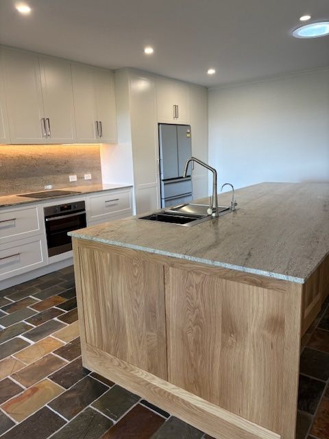 There Is A Large Island In The Middle Of The Room — Simonetto'S Cabinets & Joinery in Nambour, QLD
