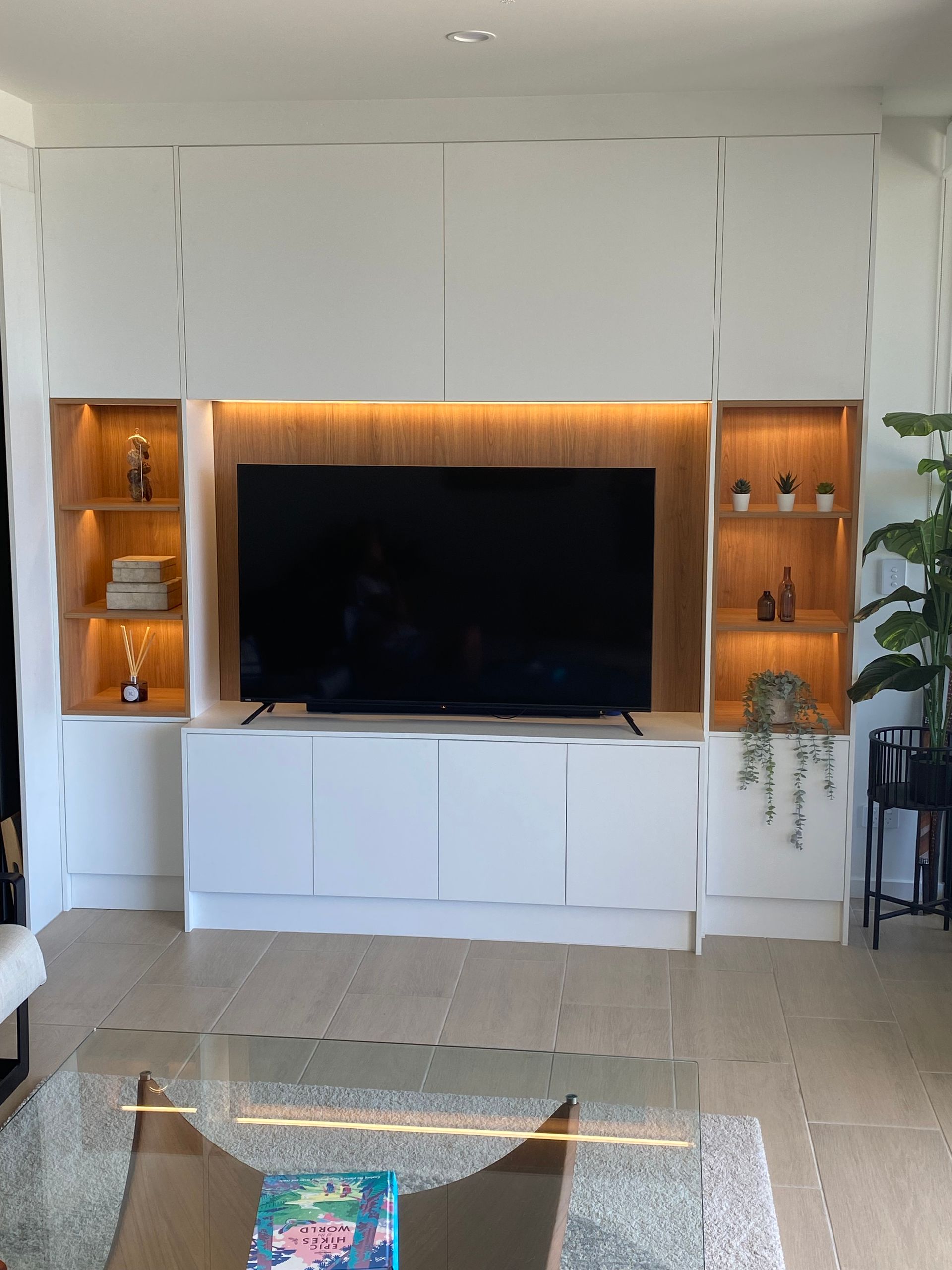 A Living Room With Two Chairs And A Flat Screen TV — Simonetto'S Cabinets & Joinery in Nambour, QLD
