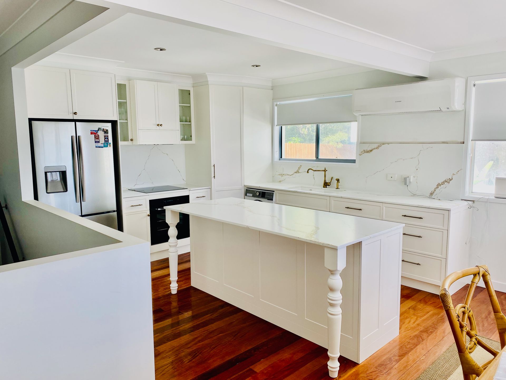 Modern Kitchen With White Cabinetry and Gray Countertops