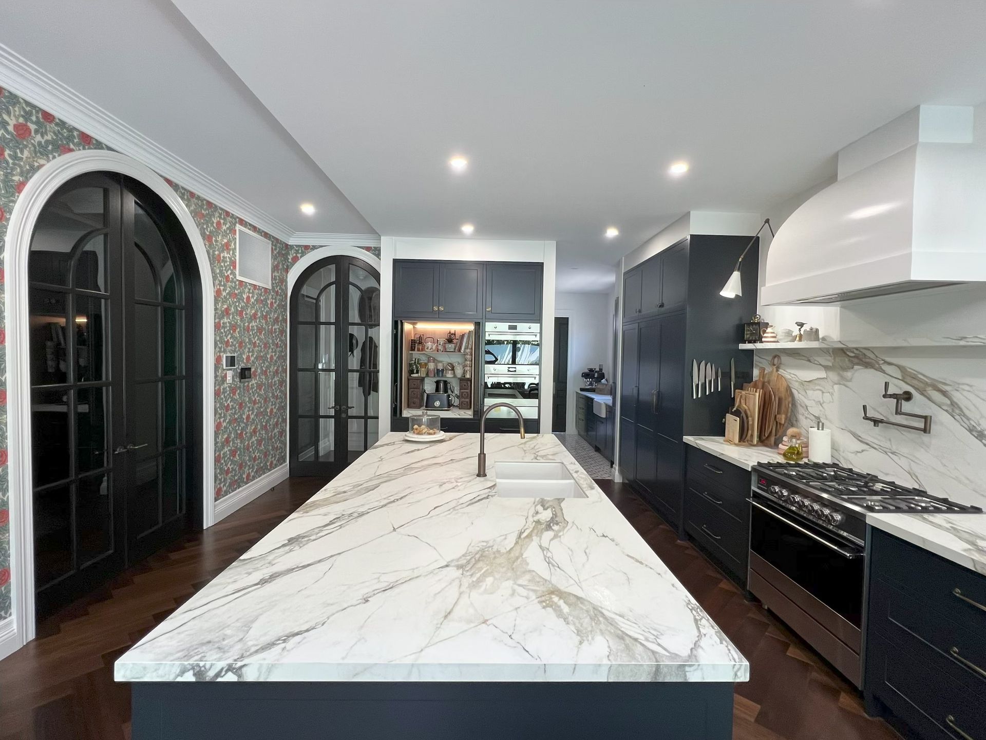 A Kitchen With Black Cabinets And A Gold Island — Simonetto'S Cabinets & Joinery in Nambour, QLD