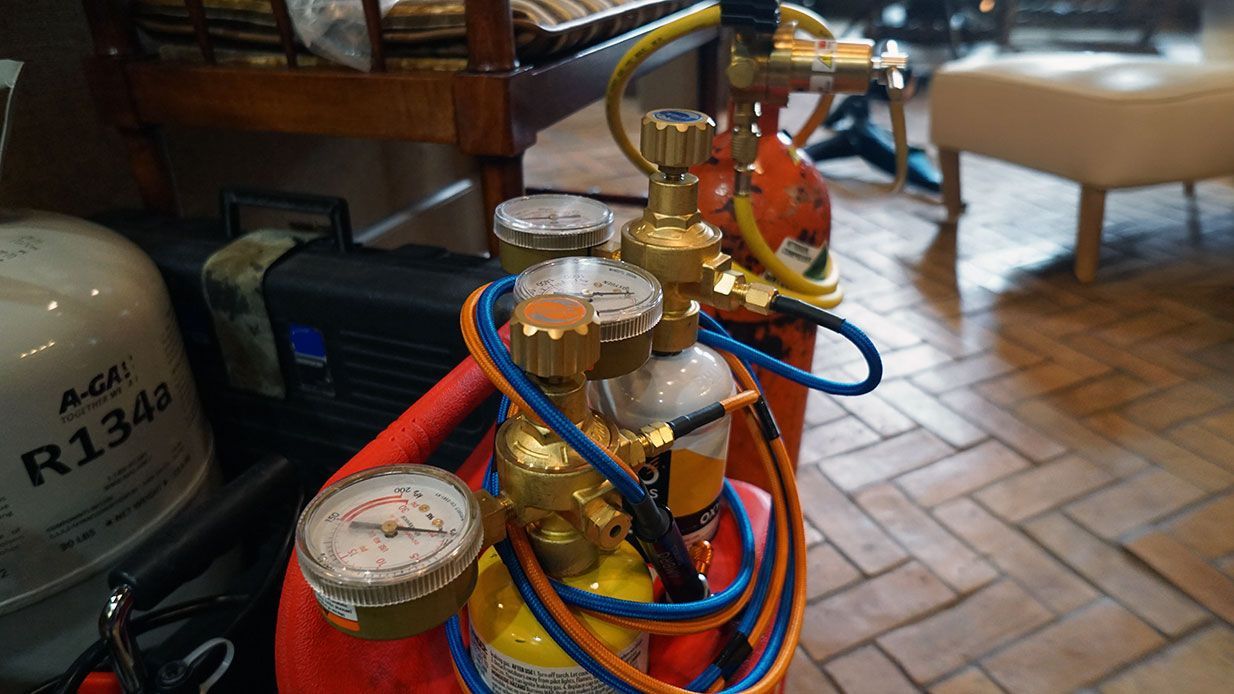 a set of refrigeration tools prepared for use in a residential repair