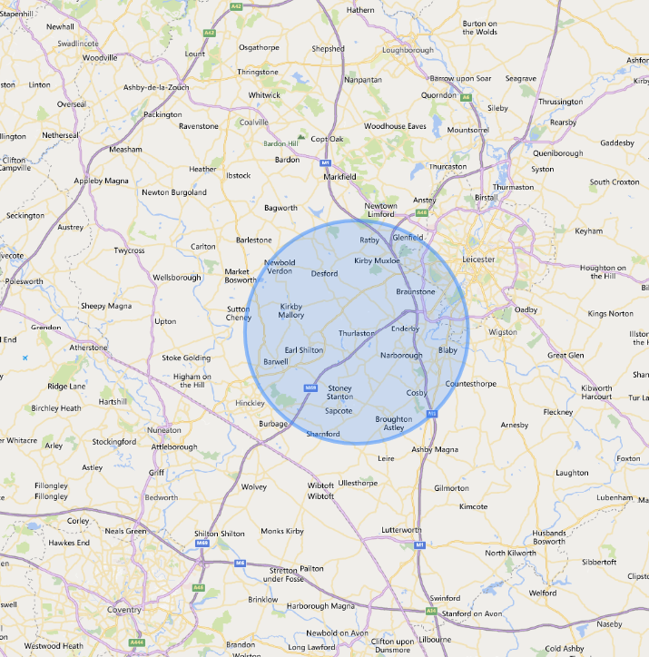 Map of an area with a blue circle, possibly indicating a search radius, covering multiple towns and roads.