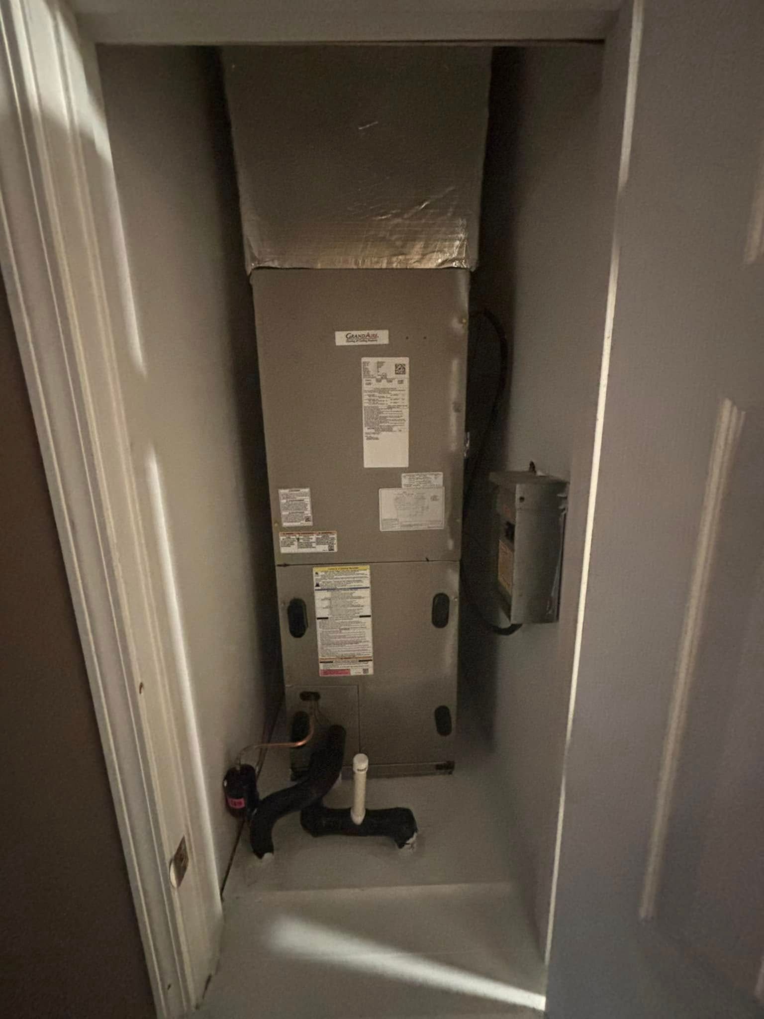 A picture of an air conditioner in a hallway.
