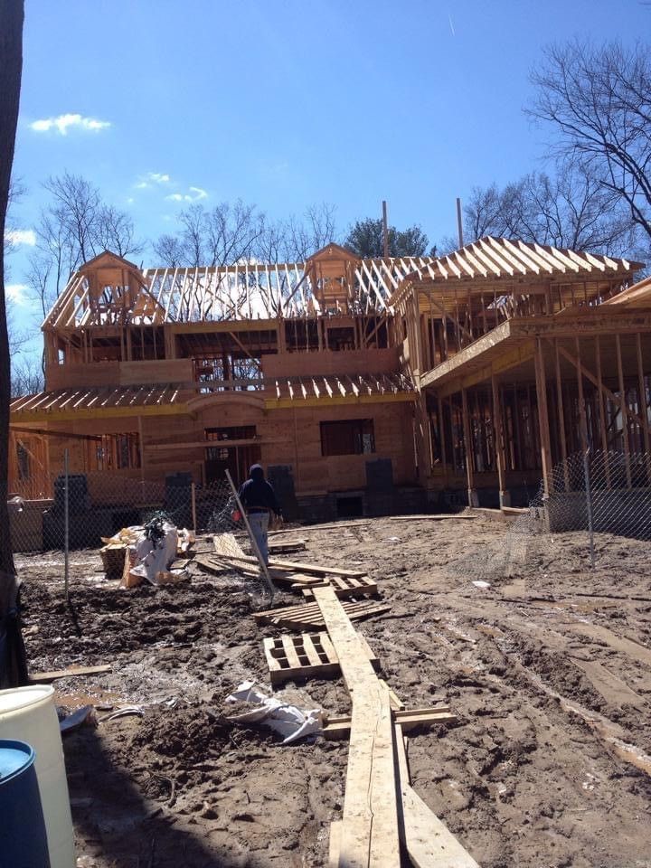 A Group Of People Are Painting The Side Of A House | Newark, NJ | Leon Brothers