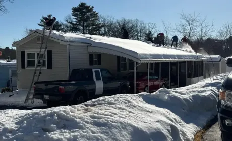A person is shoveling snow with a shovel.