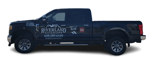 Black pickup truck with business logo on the side.