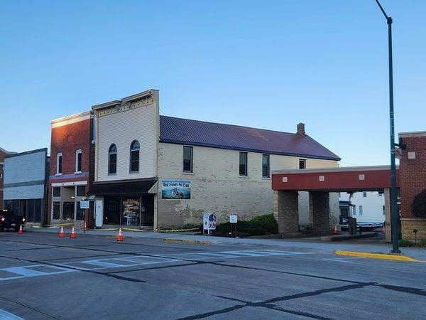 A brick building with a sign that says ' welcome ' on it — Holmen, WI — Riverland Exteriors Corporation