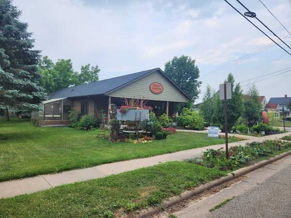A house with a car parked in front of it — Holmen, WI — Riverland Exteriors Corporation
