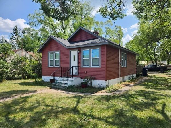 A small red house with a white door — Holmen, WI — Riverland Exteriors Corporation