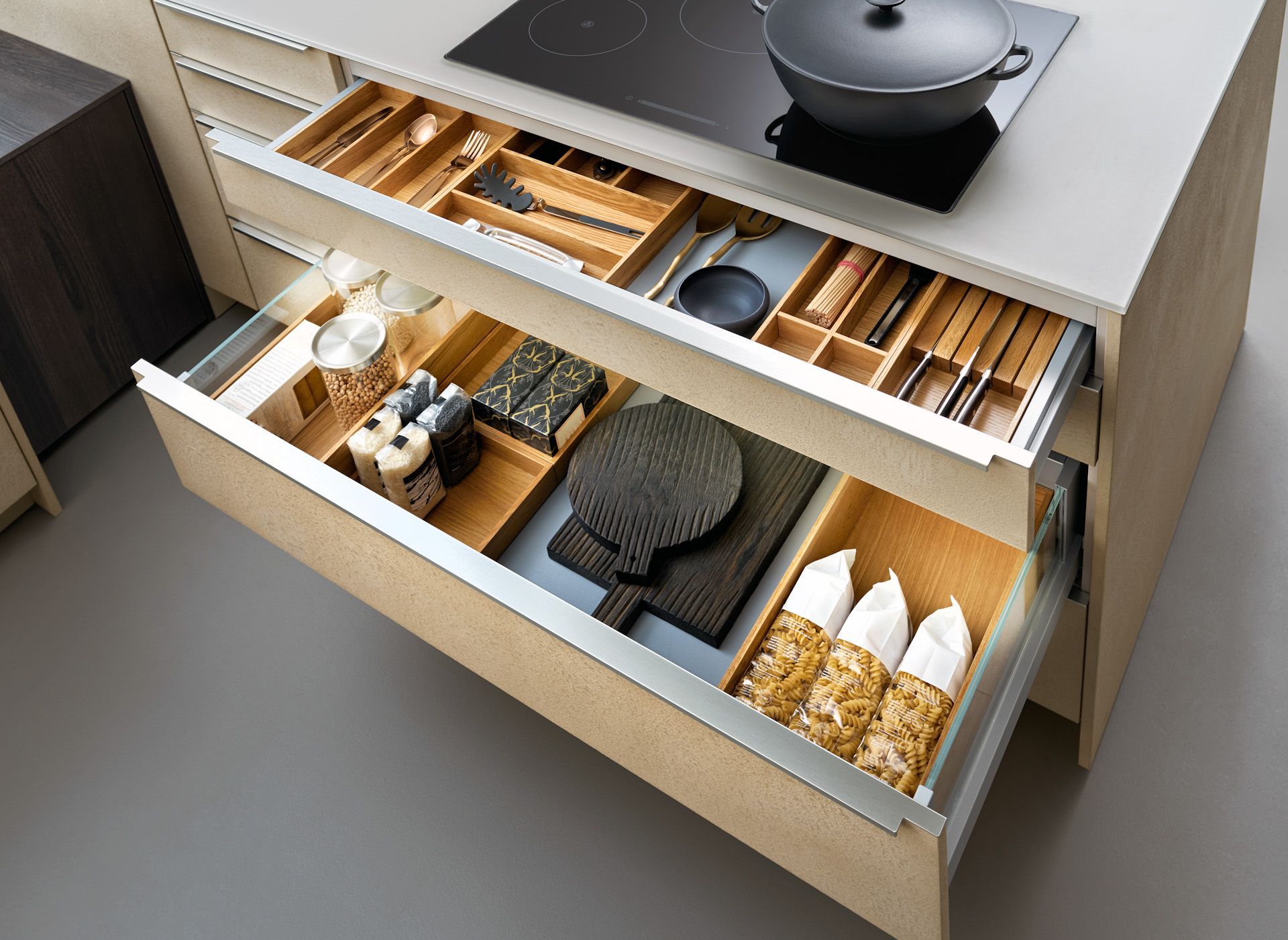 A kitchen with a lot of drawers and a stove top oven