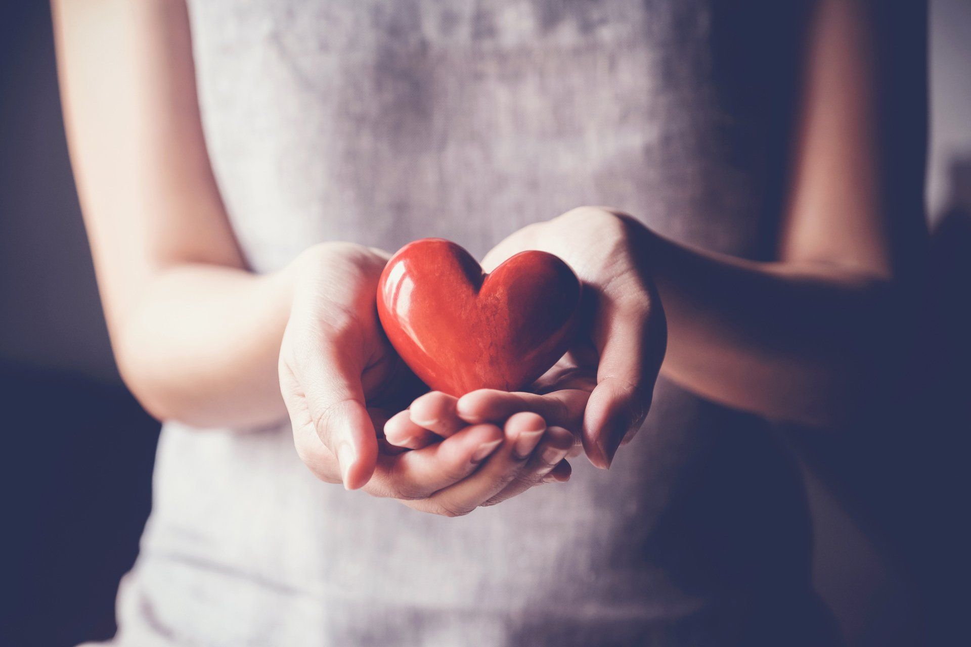 Woman Holding a Heart Shape — Ripley, TN — S.N. Anthony Insurance Inc.
