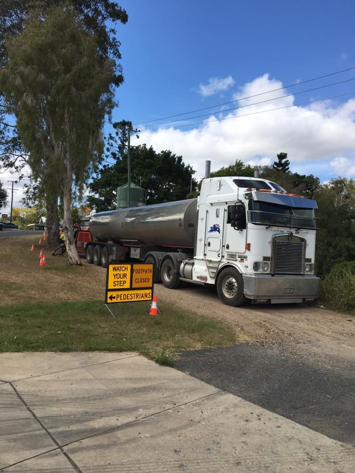 A Large Semi Truck Is Parked on The Side of The Road — Stolzenberg Water Carriers in Chatsworth, QLD