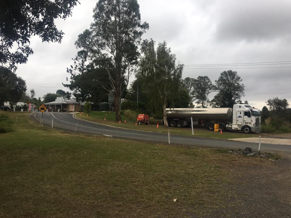 A White Truck Is Parked on The Side of The Road — Stolzenberg Water Carriers in Chatsworth, QLD