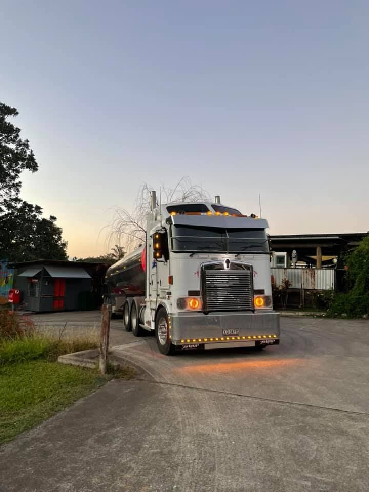 A Semi Truck Is Parked on The Side of The Road in A Parking Lot — Stolzenberg Water Carriers in Curra, QLD