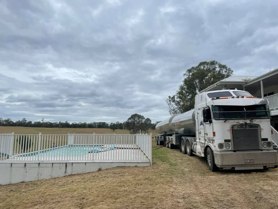 A Semi Truck Is Parked in Front of A Swimming Pool — Stolzenberg Water Carriers in Chatsworth, QLD