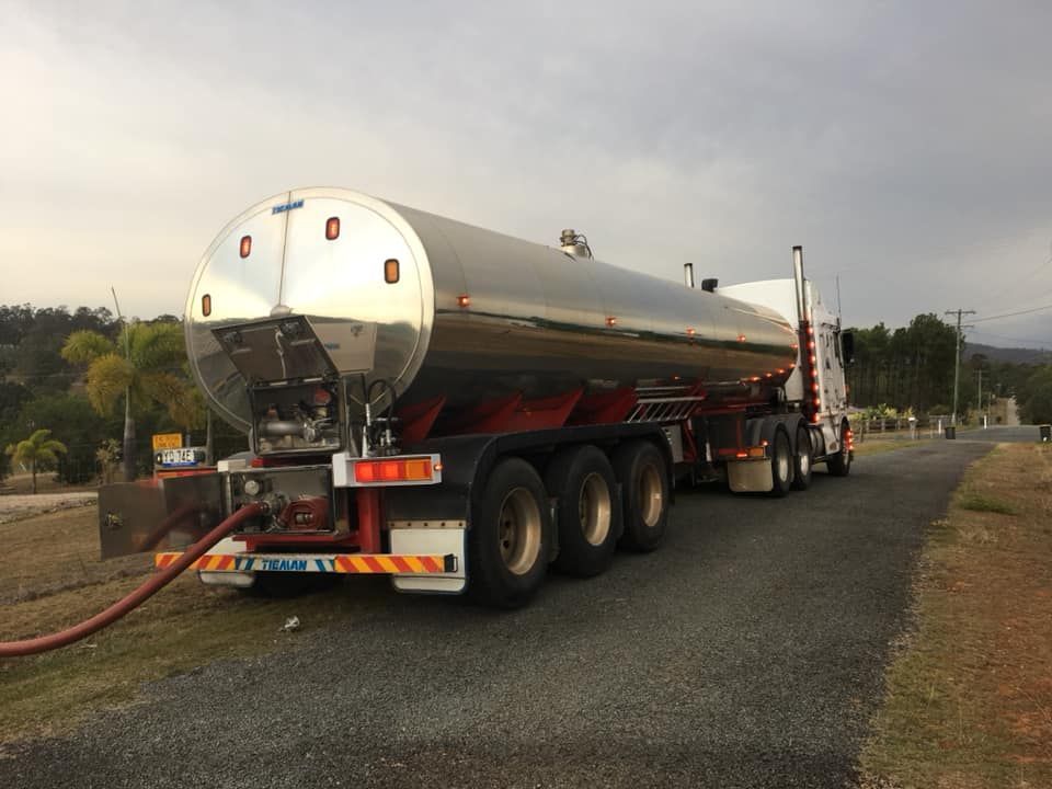 A Large Tanker Truck Is Parked on The Side of The Road — Stolzenberg Water Carriers in Chatsworth, QLD