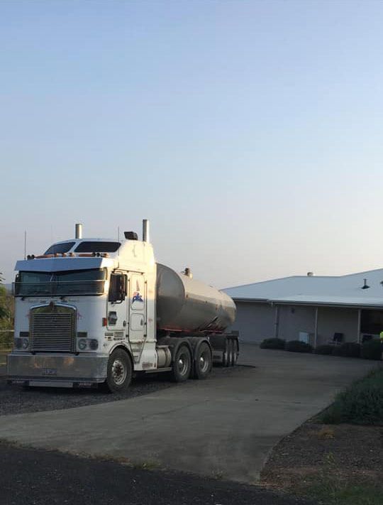 A Semi Truck Is Parked in Front of A House — Stolzenberg Water Carriers in Chatsworth, QLD
