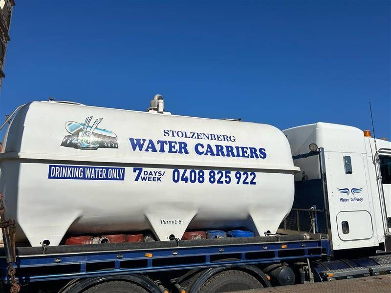 A White Water Carriers Truck Is Parked on The Side of The Road — Stolzenberg Water Carriers in Chatsworth, QLD