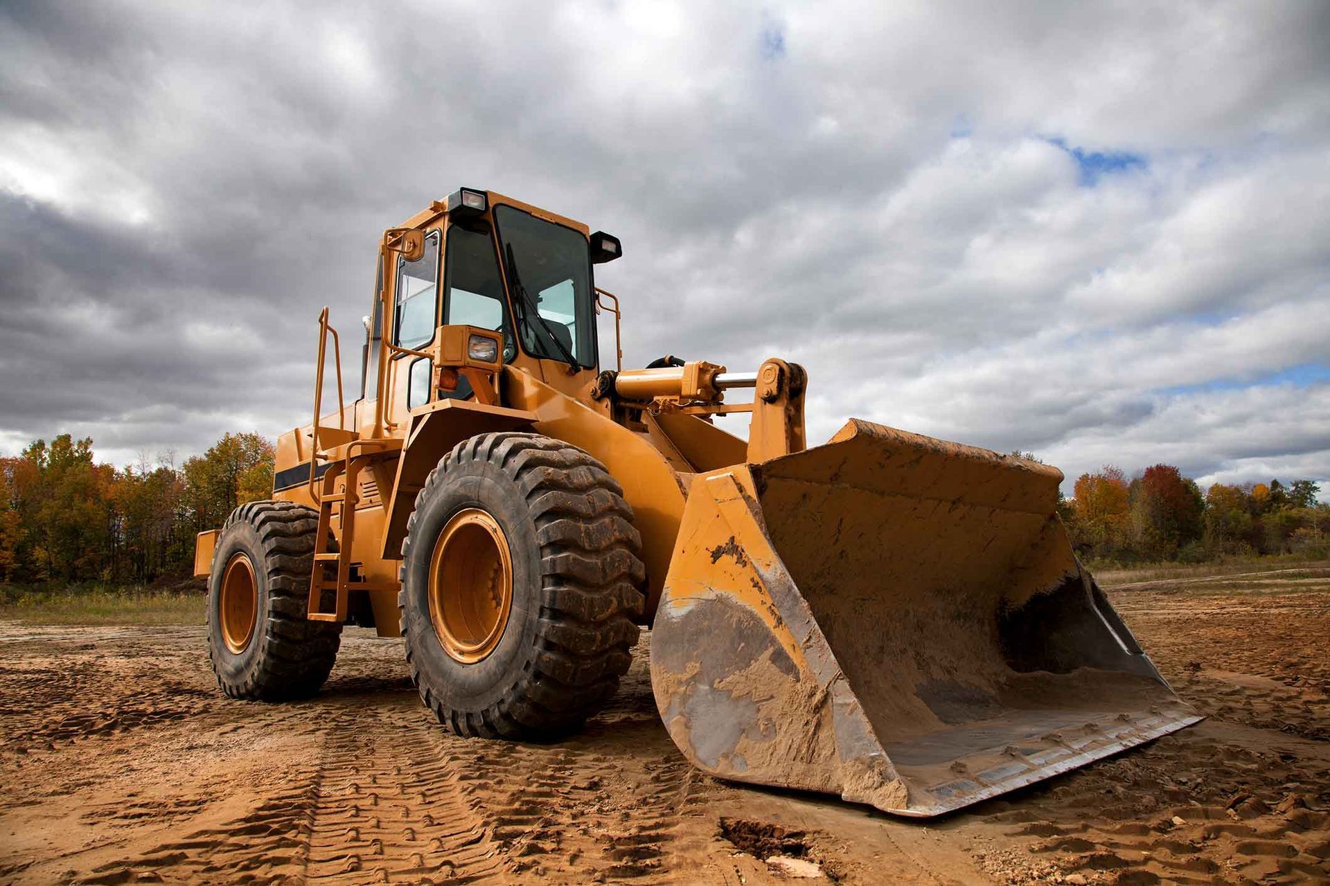 A Yellow Bulldozer Is Sitting On Top Of A Dirt Field – Port Pirie, SA - Flinders Earthmoving & Blue Metal Supplies
