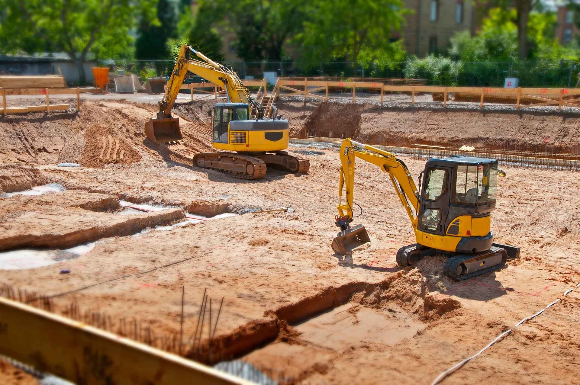 Two Yellow Excavators Are Working On A Construction Site – Port Pirie, SA - Flinders Earthmoving & Blue Metal Supplies