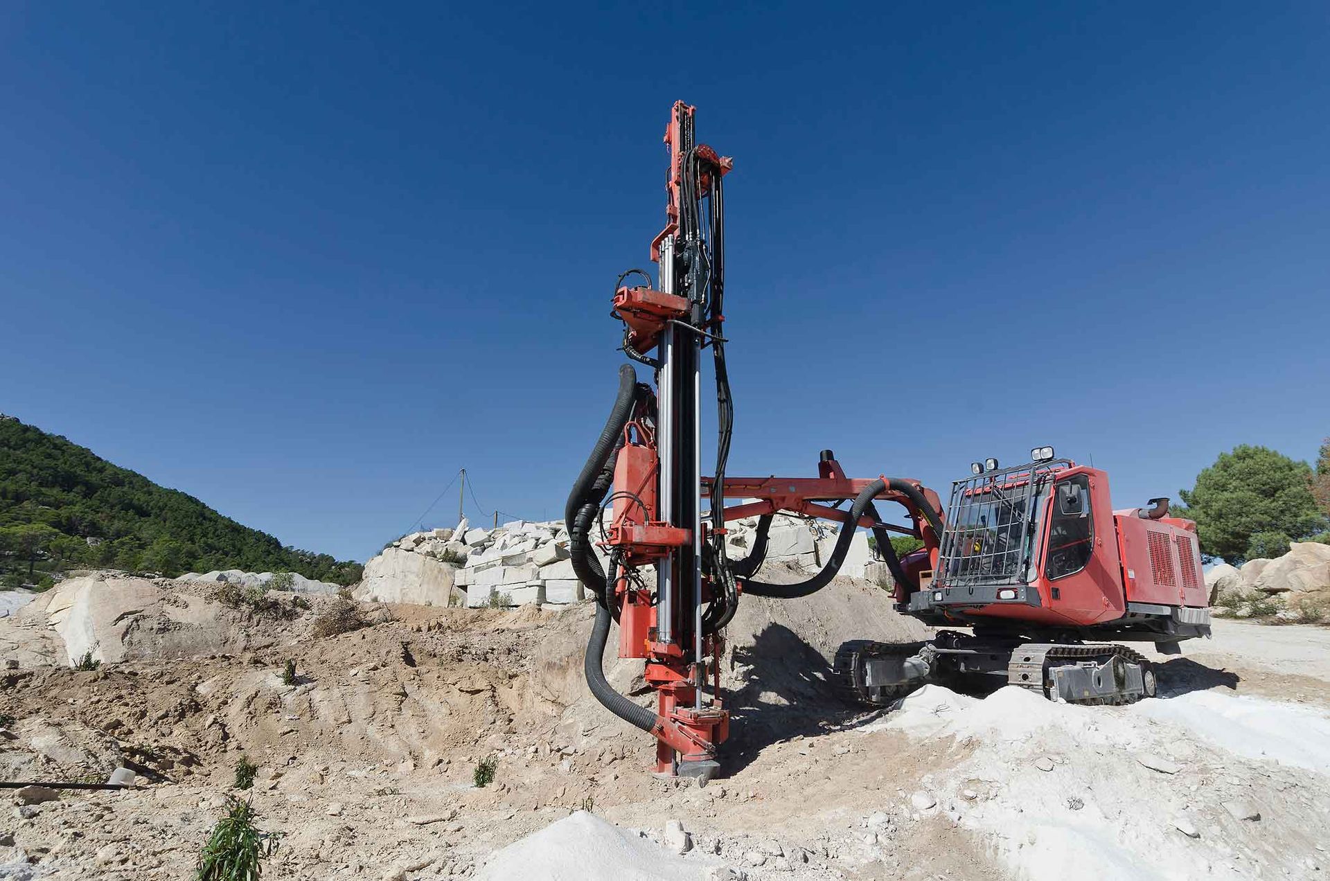 A Red Drill Is Sitting In The Middle Of A Dirt Field – Port Pirie, SA - Flinders Earthmoving & Blue Metal Supplies
