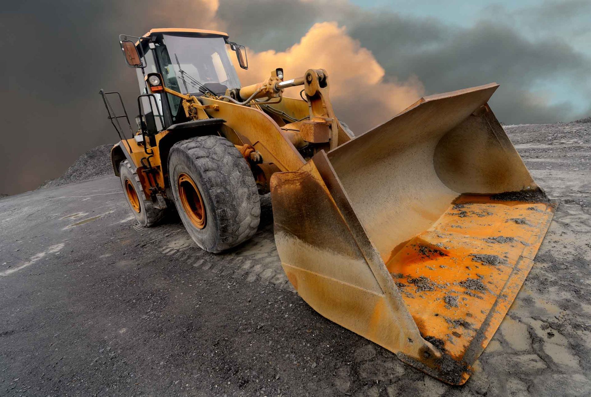 A Bulldozer Is Sitting On Top Of A Dirt Hill – Port Pirie, SA - Flinders Earthmoving & Blue Metal Supplies