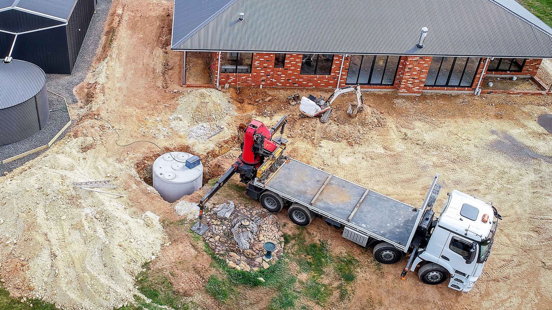 An Aerial View Of A Construction Site With A Truck And A Crane – Port Pirie, SA - Flinders Earthmoving & Blue Metal Supplies