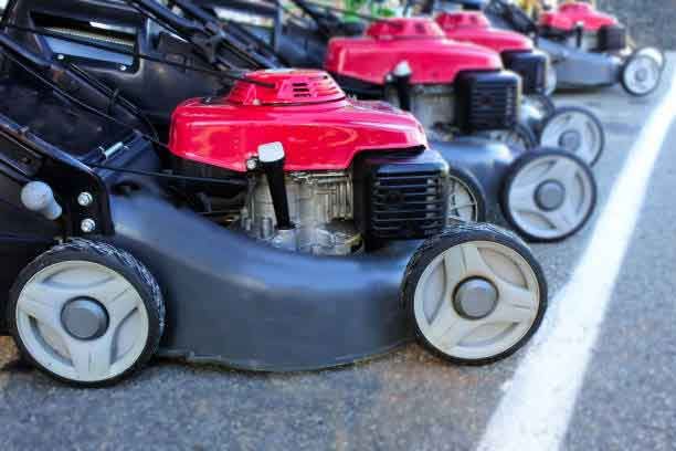 A Row Of Lawn Mowers Are Parked In A Parking Lot – Port Pirie, SA - Flinders Earthmoving & Blue Metal Supplies