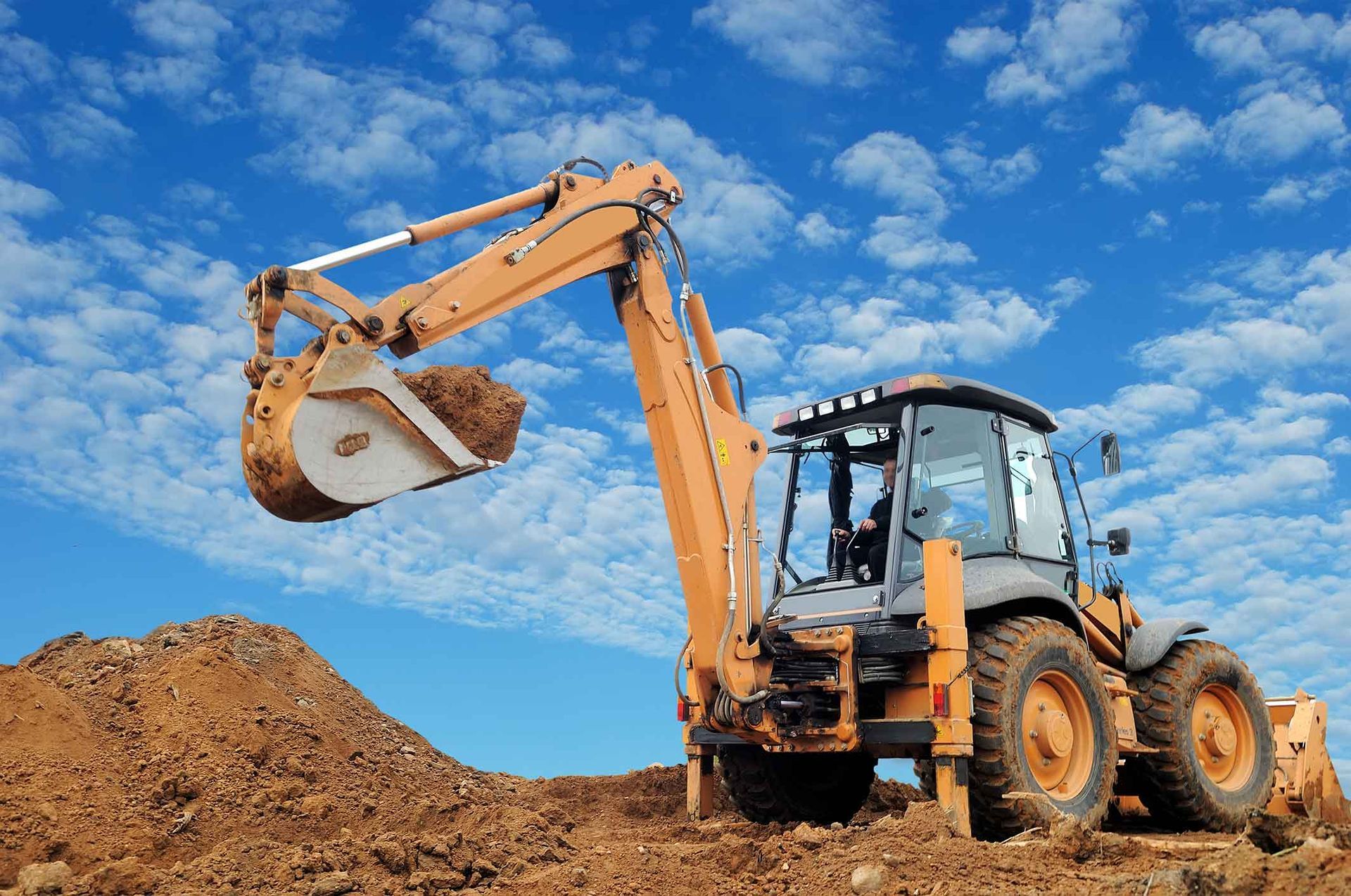 A Bulldozer Is Digging A Pile Of Dirt On A Construction Site – Port Pirie, SA - Flinders Earthmoving & Blue Metal Supplies