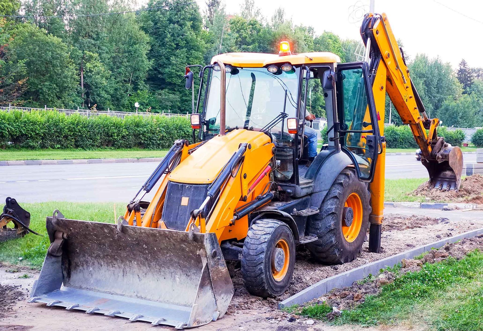 A Yellow Bulldozer Is Parked On The Side Of The Road – Port Pirie, SA - Flinders Earthmoving & Blue Metal Supplies