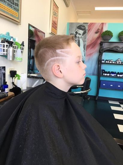 A Young Boy is Getting His Hair Cut at a Barber Shop — Southside Hair & Beauty Design In South Tamworth, NSW