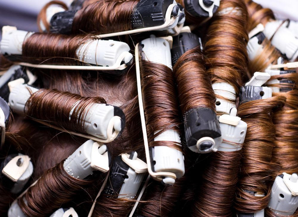 A Close Up of a Woman 's Hair With Curlers in It — Southside Hair & Beauty Design In South Tamworth, NSW