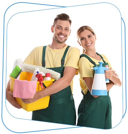 Two smiling people in yellow shirts and green overalls holding cleaning supplies.