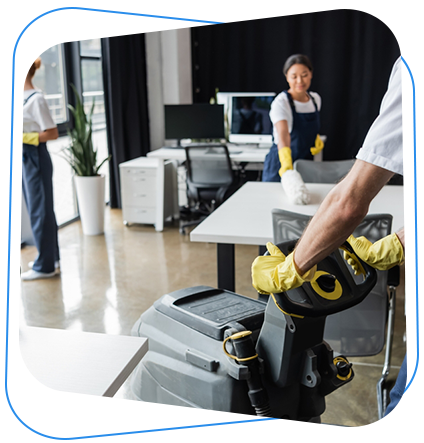 Janitors cleaning an office with machines and cloths.