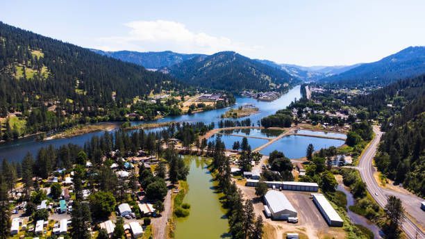 Aerial View of River Surrounded by Mountains and Trees | Missoula, MT | River City Rentals LLC