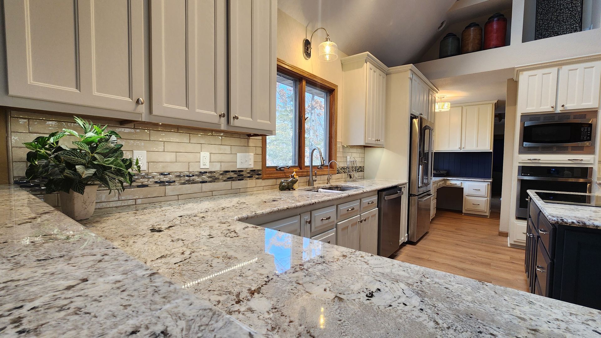 A room that is being remodeled with a bucket on the floor.