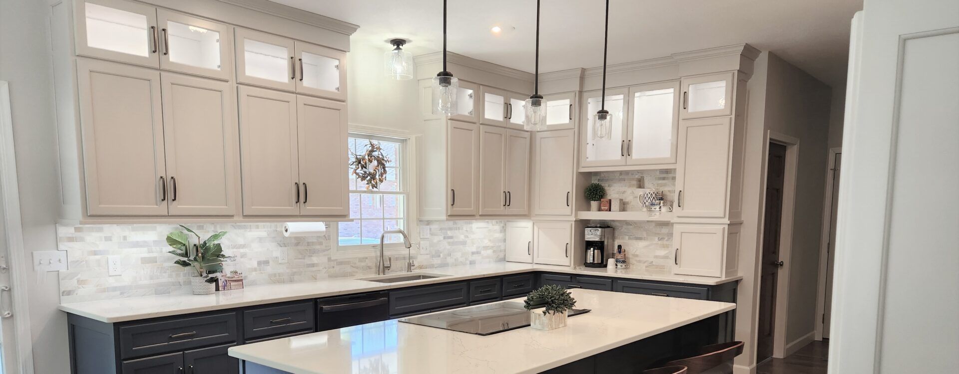 A kitchen with a large island in the middle of it.