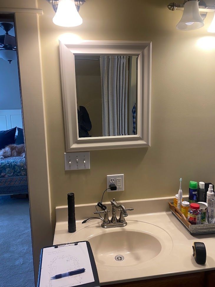 A bathroom sink with a mirror.