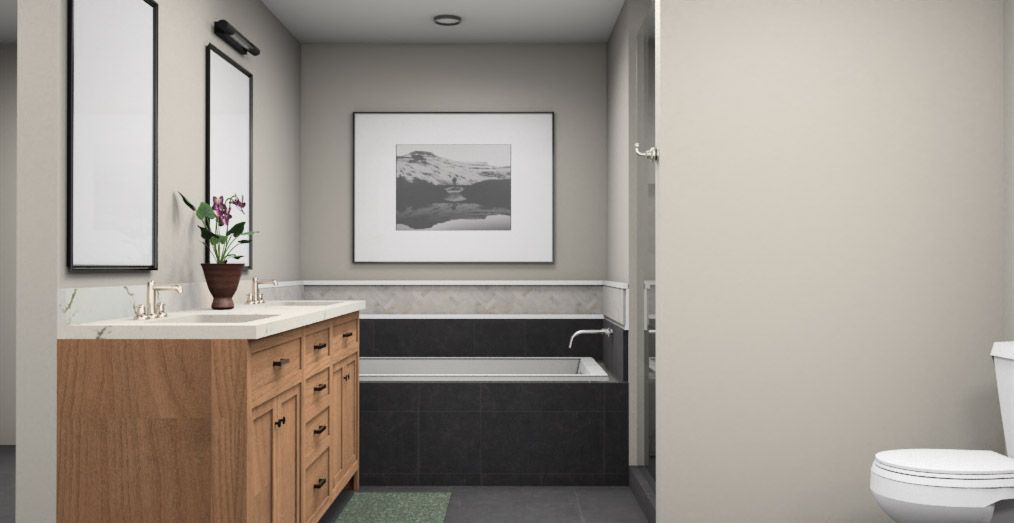 Bathroom with a wood vanity, bathtub, and framed art.