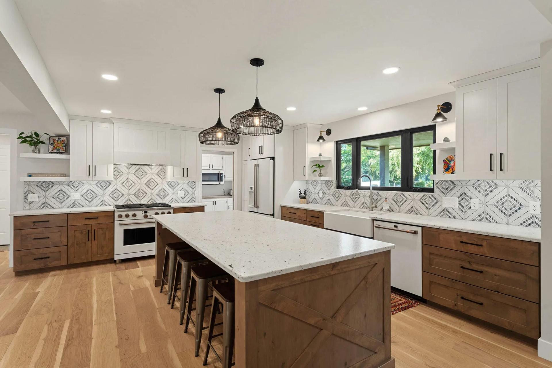 A kitchen with a large island in the middle of the room.