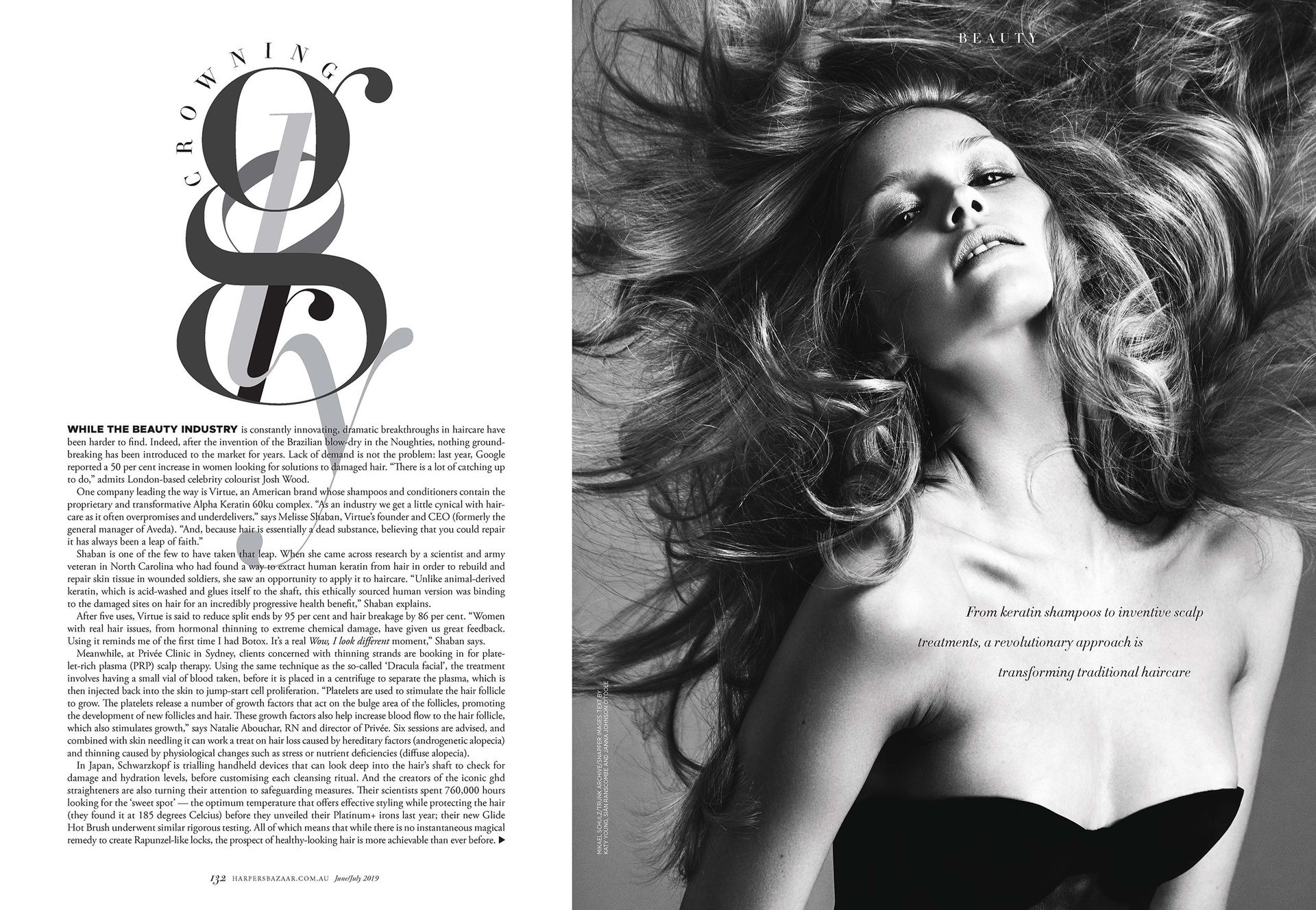 Woman with voluminous hair in black and white next to a text-filled page with stylized letters.