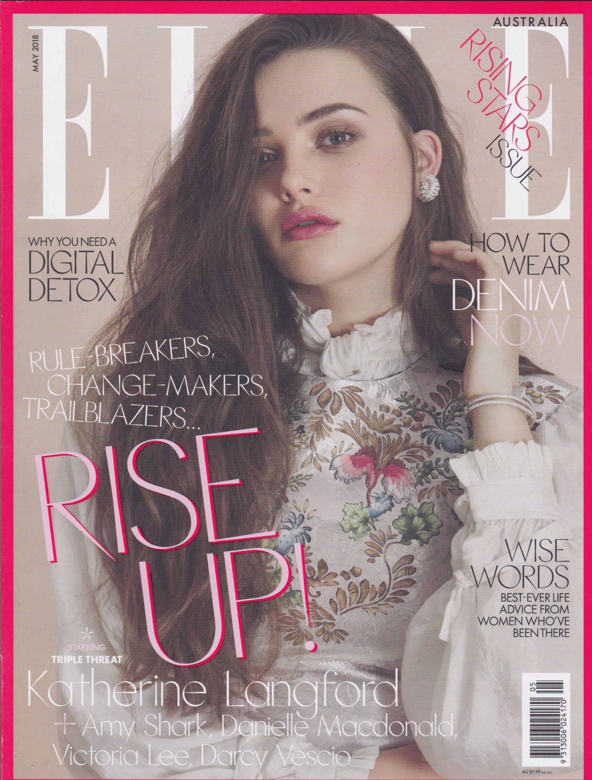 ELLE magazine cover featuring Katherine Langford. She wears a floral blouse and gazes at the camera. Pink accents.