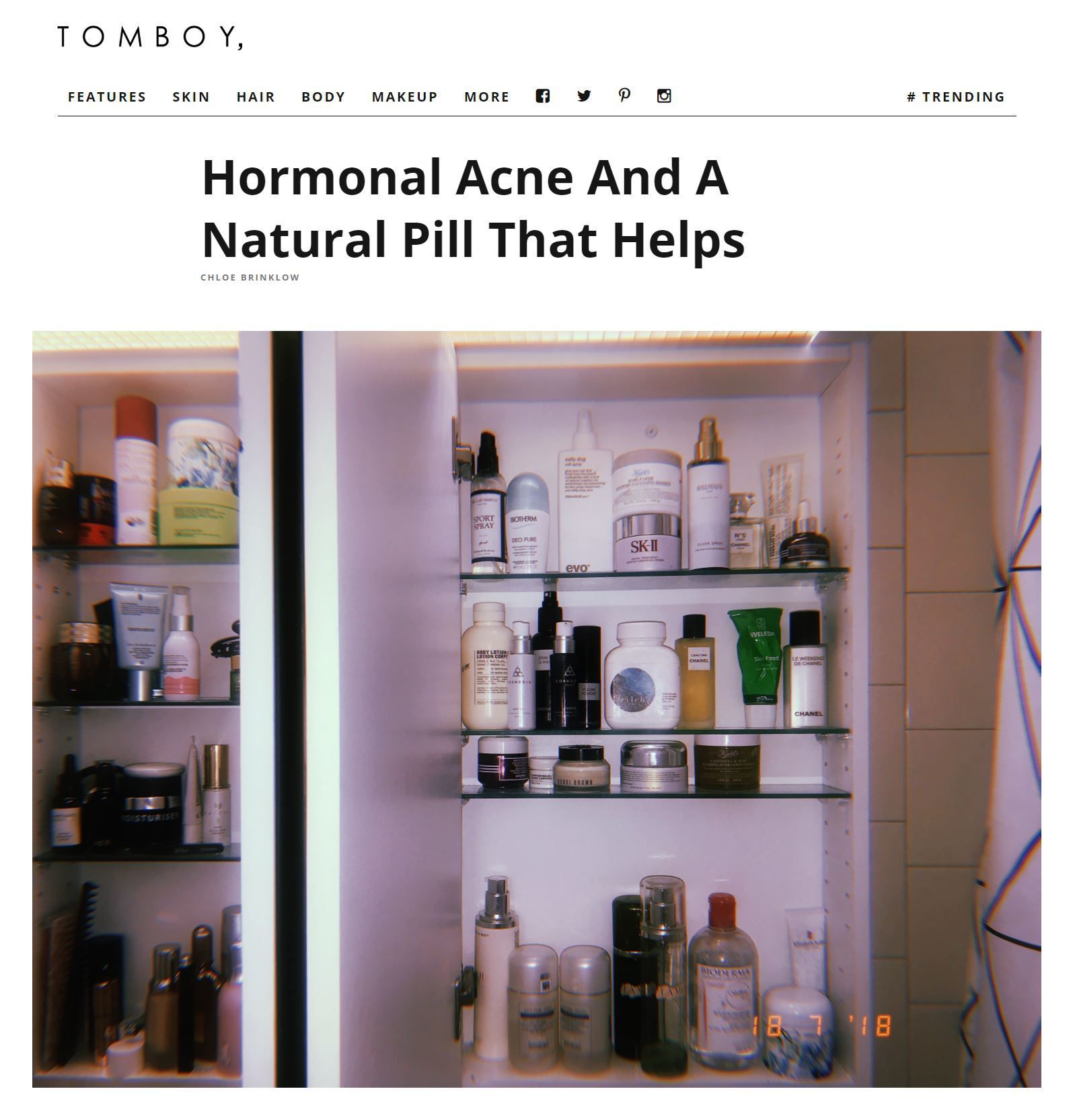 Medicine cabinet filled with skincare products, featured in an article about hormonal acne.